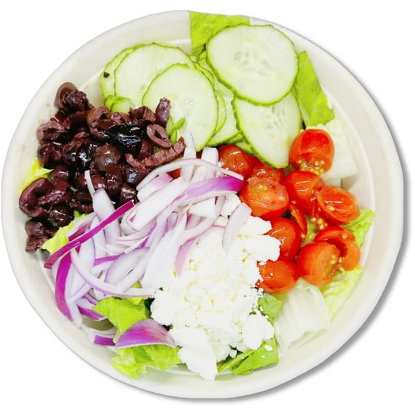 A vibrant Salad Fox salad with lettuce, cucumbers, olives, red onions, cherry tomatoes, and feta cheese.