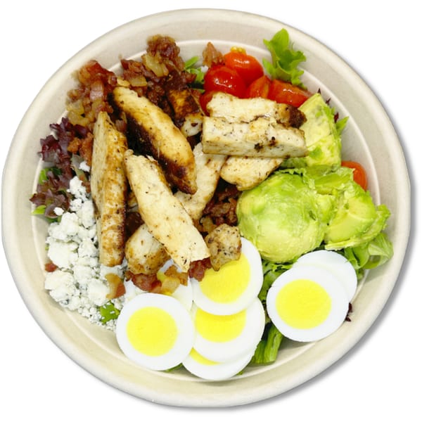 A Salad Fox Cobb salad with chicken, bacon, avocado, tomatoes, eggs, and feta cheese.